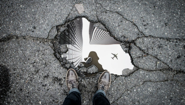 standing-over-pothole-marc-olivier-jodoin-502572-unsplash