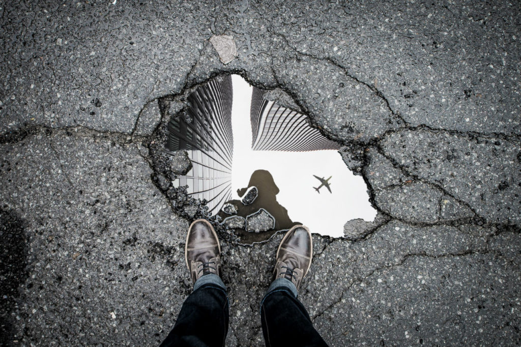 standing-over-pothole-marc-olivier-jodoin-502572-unsplash